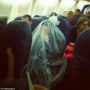 Orthodox Jew covers him in plastic bag during flight as a Kohein is not allowed to fly over cemeteries