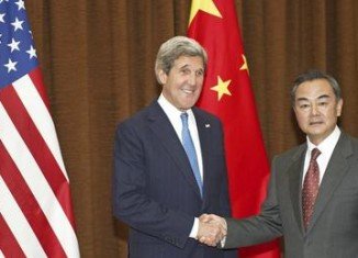 US Secretary of State John Kerry has arrived in Beijing to urge China's leaders to use their influence on North Korea to reduce regional tensions