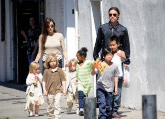 Angelina Jolie kept her family life as normal as possible for the sake of her children as she underwent a double mastectomy