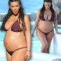 Kim Kardashian shows off growing baby bump in bikini