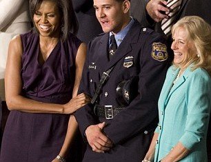 Former Philadelphia police officer Richard DeCoatsworth once hailed as a hero and given a seat next to Michelle Obama, has been arrested and charged with rape and other crimes