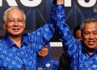 Malaysia’s ruling National Front coalition has won a simple majority in the country's parliamentary election, extending its 56-year rule