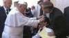 TV 2000 images show a man apparently reacting to Pope Francis putting his hands on his head