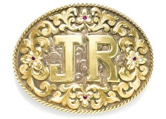The centerpiece of the items owned by Larry Hagman is a silver-and-gold belt buckle engraved with the initials of his character J.R. Ewing