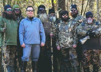 Alan Robertson pictured with his brothers Willie and Jase, father Phil, uncle Si, brother Jeptha and duck call makers Justin Martin and John Godwin