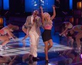 Christina Aguilera showed off her thin frame during her spirited performance of Feel This Moment with rapper Pitbull on The Voice Season 4 finale