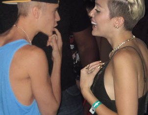 Miley Cyrus has denied rumors of a romance with Justin Bieber after they were pictured together at a club in LA