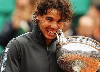 Rafael Nadal won a record eighth French Open title after beating fellow Spaniard David Ferrer
