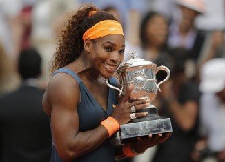 Serena Williams won a second French Open title 11 years after her first with a convincing win over defending champion Maria Sharapova