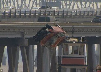 A young woman survived when her car was knocked 40ft off Chesapeake Bay Bridge