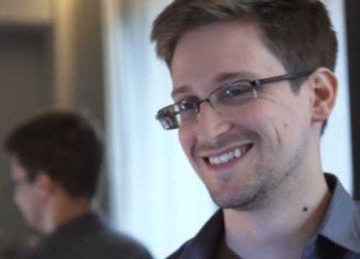 Edward Snowden is being given an official pass to leave Moscow's Sheremetyevo airport