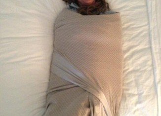 Jessica Simpson shared bizarre photo of mother Tina tightly swaddled in a blanket