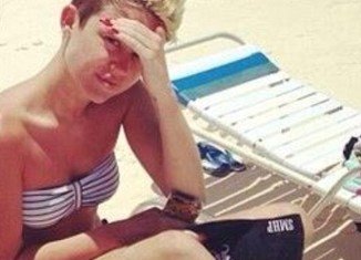 Miley Cyrus ditched make-up and clothes on her holiday in the Bahamas