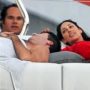 Lauren Silverman cuddles up to Simon Cowell as her husband looks on