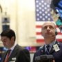US shares closing at record levels after Fed reassurance
