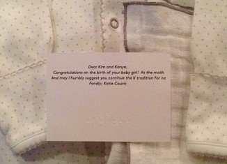 Kim Kardashian uploaded a picture of baby clothes and a note sent by Katie Couric
