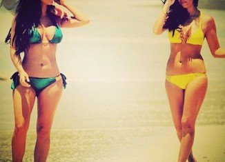 Kourtney Kardashian wanted to remind followers of Kim's existence by tweeting a bikini snap of the two taken on holiday in Mexico in 2011