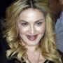 Madonna wears gold grills to visit Rome branch of her Hard Candy fitness studio
