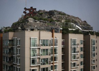 Professor Zhang Lin has spent six years building his dream mountaintop villa on top of a Beijing apartment block