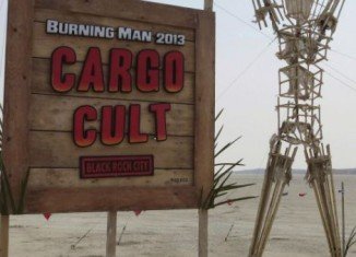 The art theme of this year’s Burning Man Festival is “Cult Cargo” and focuses on a strange being called John Frum
