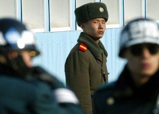 North Korea has agreed to restore a military hotline with the South as tensions between the two countries ease