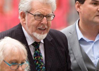 Rolf Harris has appeared in court charged with nine counts of indecent assault
