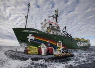 Fourteen Greenpeace activists have been charged with piracy by the Russian authorities