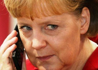 Germany has summoned the US ambassador in Berlin over claims that the US monitored Angela Merkel's mobile phone