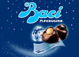 Perugina's Baci chocolate bonbons are filled with hazelnut chocolate cream, topped with a whole hazelnut, and wrapped in a love note