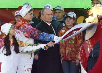 Vladimir Putin has taken part in a ceremony in Moscow to launch the torch relay for 2014 Winter Olympics in Sochi