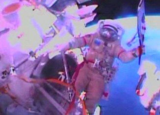 Cosmonauts Oleg Kotov and Sergei Ryazansky are taking the torch for the Sochi Winter Olympics on its first historic spacewalk