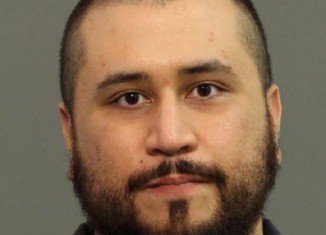 George Zimmerman has been arrested on charges he pointed a shotgun at his girlfriend