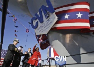 Gerald Ford's daughter, Susan Ford Bales, smashed the traditional bottle of champagne into the ship at a ceremony in Virginia