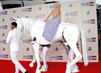 Lady Gaga arrived on the red carpet at the 2013 American Music Awards on top of a fake white horse