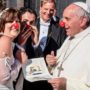 Pope Francis clowns around with newlywed couple inside Vatican