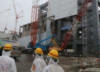 Stricken Fukushima nuclear plant has begun removing fuel rods from a storage pond at the Unit 4 reactor building