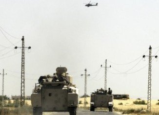 Ten Egyptian soldiers are reported killed and dozens more wounded in a car bomb attack near the North Sinai city of el-Arish