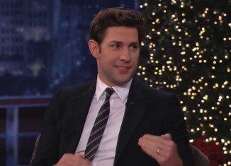 Upon returning home, John Krasinski was greeted by a group of carolers, and a small surprise sent to deliver Jimmy Kimmel's yuletide cheer