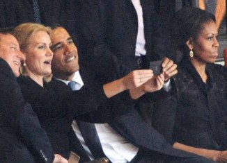 Barack Obama was caught smiling and taking a selfie with Helle Thorning-Schmidt and David Cameron during Nelson Mandela's massive memorial service