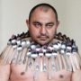 Etibar Elchiyev: Magnetic Man breaks Guinness World record for carrying metal spoons on his body