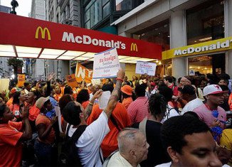 Fast-food restaurant workers are staging a 24-hour strike in protest against low wages
