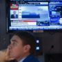 World stock markets rise after Fed stimulus trim announcement