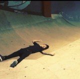 Justin Bieber wiping out on his skateboard as he attempts to perform a move