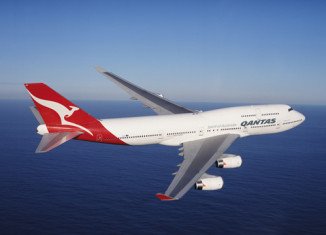 Qantas issued a surprise profit warning and announced 1,000 job cuts