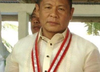Ukol Talumpa, mayor of the southern town Labangan, and three others were hit while waiting outside the airport terminal