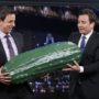 Jimmy Fallon hands off Late Night giant pickle to Seth Meyers