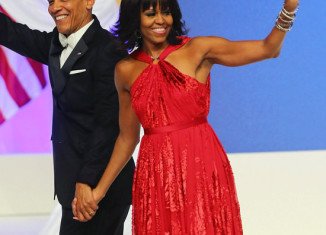 Michelle Obama’s ruby-colored chiffon gown made by designer Jason Wu is being lent to the National Museum of American History for a year