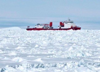 The Xue Long became ice-bound after helping to rescue 52 passengers stranded on Russian research vessel Akademik Shokalskiy