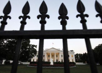 A man has been arrested by the US Secret Service after trying to climb over the White House fence, leading to a security lockdown