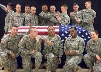 A member of the Wisconsin National Guard was suspended from honor guard duties after she apparently posted this photo to social media